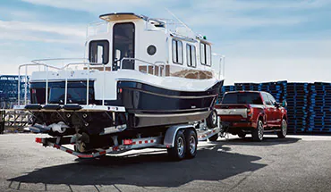 2022 Nissan TITAN Truck towing boat | Taylor's Auto Max Nissan in Great Falls MT