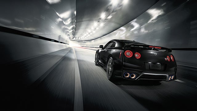 2023 Nissan GT-R seen from behind driving through a tunnel | Taylor's Auto Max Nissan in Great Falls MT